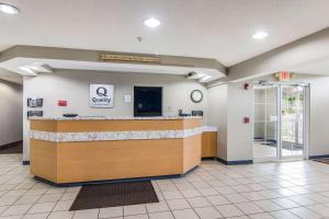 a lobby with a cash register and a waiting room at Quality Inn & Suites Grove City-Outlet Mall in Grove City