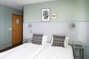 Postel nebo postele na pokoji v ubytování Hotel Höfn