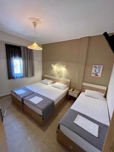 Llit o llits en una habitació de Afrodite Beach
