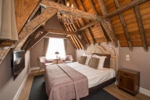 Postel nebo postele na pokoji v ubytování Boutique Hotel Huys van Leyden