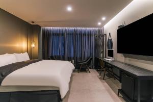 TV a/nebo společenská místnost v ubytování Namyangju Aone Hotel + 37 fotografií