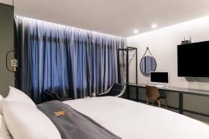 TV a/nebo společenská místnost v ubytování Namyangju Aone Hotel