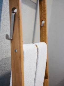 a pair of towels hanging on a closet door at Weingut Straka in Rechnitz