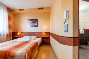 Postel nebo postele na pokoji v ubytování Corner Motel