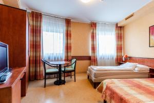 Postel nebo postele na pokoji v ubytování Corner Motel + 24 fotografií