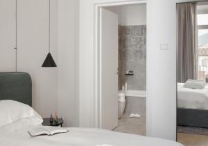 Posteľ alebo postele v izbe v ubytovaní BB Hotels Aparthotel Collection Il Michelangelo