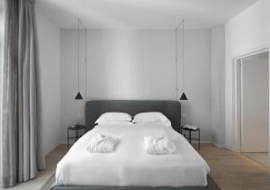 Posteľ alebo postele v izbe v ubytovaní BB Hotels Aparthotel Collection Il Michelangelo