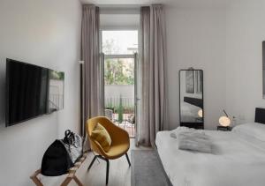 Posteľ alebo postele v izbe v ubytovaní BB Hotels Aparthotel Collection Il Michelangelo