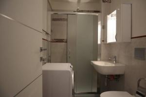 a bathroom with a toilet and a sink at App. a 30mt dal mare in Pietra Ligure