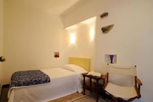 A bed or beds in a room at Borgata Cantone Country House B&B