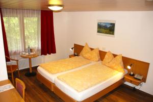 Letto o letti in una camera di Hotel Eigerblick