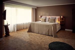 Postel nebo postele na pokoji v ubytování Van der Valk Hotel Emmeloord