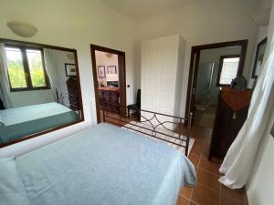 A bed or beds in a room at Villetta a Corigliano D'Otranto