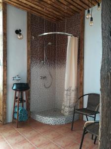 a bathroom with a shower with a shower curtain at Kuldiga Kalna Apartment in Kuldīga