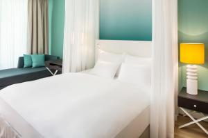 Voodi või voodid majutusasutuse Falkensteiner Hotel & Spa Jesolo toas