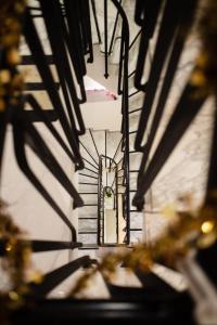 an overhead view of a stairway in a building at Hôtel des Arcades in Reims +34 photos