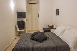 Een bed of bedden in een kamer bij B&B Colonna - Mole Sua Stat