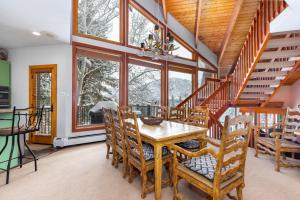 a dining room with a table and chairs at Pinnacle #1484 in Park City