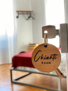 a tag on a door with the words authentic room at B&B Monteverdi L'Arancio in Florence
