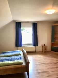 a bedroom with a bed and a large window at Na Červené louce relax 2 in Cheb