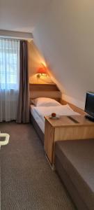 Postel nebo postele na pokoji v ubytování Hotel Garni "Am Ellinger Tor"