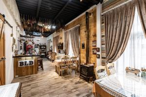 a living room with wooden floors and a table and chairs at Brulee's Done in Dongshan