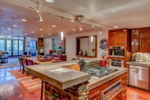 a kitchen with a counter top and a living room at 605 Deer Valley Drive in Park City