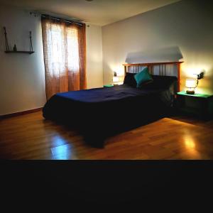 Posteľ alebo postele v izbe v ubytovaní Cornu Karma Apartment Siuranella
