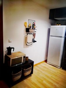 Kuchyňa alebo kuchynka v ubytovaní Cornu Karma Apartment Siuranella