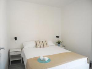 Posteľ alebo postele v izbe v ubytovaní Appartamenti Eneide - Le Vie di Omero