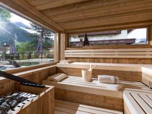 a sauna with a view of a mountain at Hotel Garni Birkenhof in Mayrhofen