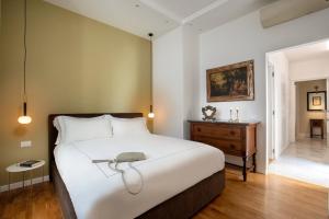 Giường trong phòng chung tại Casavignoni luxury apartment with terrace