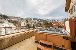 a hot tub on the balcony of a house at 601 Deer Valley Drive in Park City