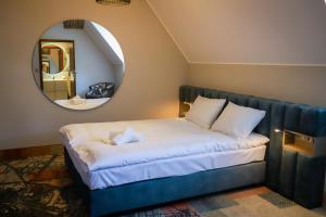 Postel nebo postele na pokoji v ubytování Pałacyk Potockiego