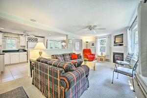 a living room with a couch and a kitchen at Serene House Less Than 2 Mi to Cranmore and N Conway Shops! in North Conway