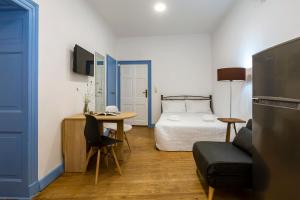 Postel nebo postele na pokoji v ubytování VAP Suites