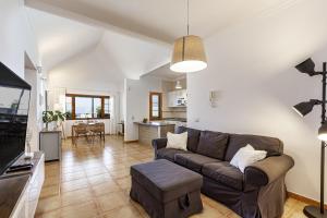 a living room with a couch and a table at Villa 21 in Puerto del Carmen