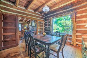a dining room with a wooden table and chairs at Rustic Dover Retreat with Porch - Walk to Boat Ramp! in Dover