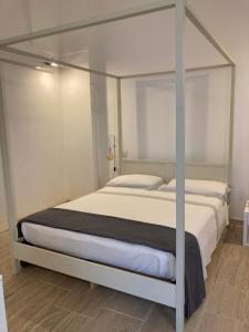 A bed or beds in a room at Corte Baracca B&B Suite
