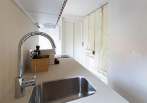 a kitchen with a sink and a window at Aeris Boutique Studio in Girona