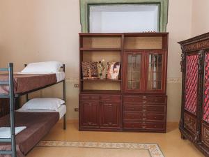 Postel nebo postele na pokoji v ubytování Salerno Experience Hostel