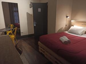Cama ou camas em um quarto em Hostel Boutique Merced 88