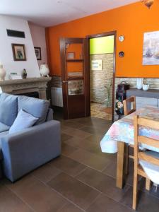 a living room with a couch and a table at Casa de Marga in San Pedro