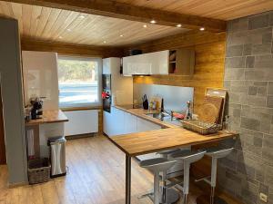 a kitchen with a sink and a counter top at Le Chalet de Hermeton in Hastière-par-delà