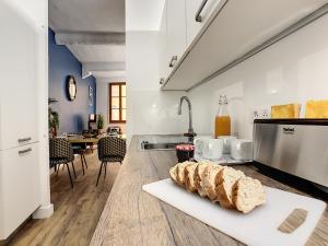 a kitchen with two loaves of bread on a counter at Coeur Vieux Nice - Place Rossetti in Nice