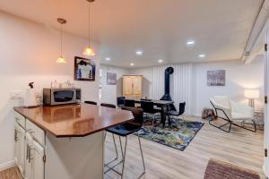 a kitchen and living room with a table and chairs at Edelweiss Haus M3 in Park City