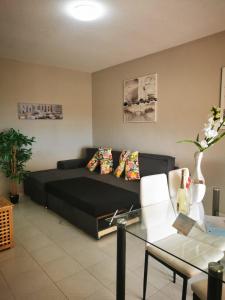 a living room with a couch and a table at Ocean View Apartment in Adeje