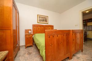 Posteľ alebo postele v izbe v ubytovaní Apartmani Loreta