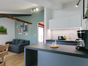 a kitchen and living room with a counter top at FantAttic apartment city center in Poreč