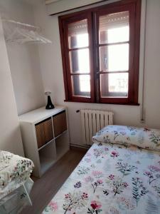 A bed or beds in a room at EL RINCON DE LUZ